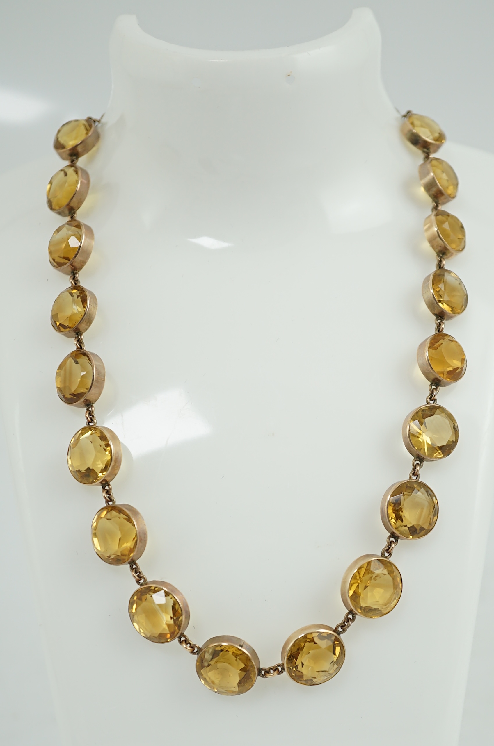 An early 19th century gold and citrine riviere necklace